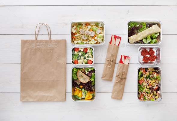 Healthy food take away in boxes, top view at wood - Stock Photo - Images