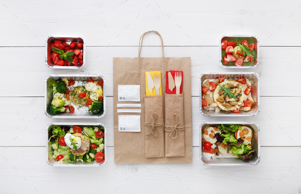 Healthy food take away in boxes, top view at wood - Stock Photo - Images