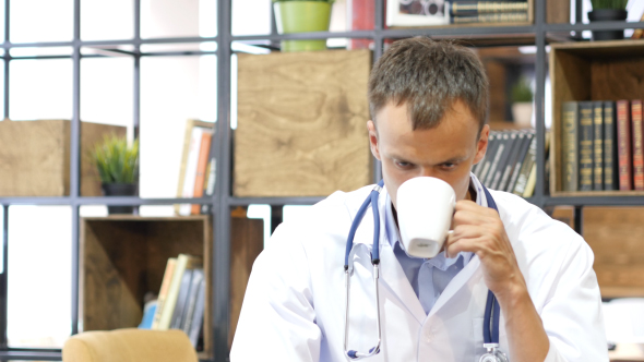 Doctor Drinking Coffee, Tea at Clinic , Stock Footage | VideoHive