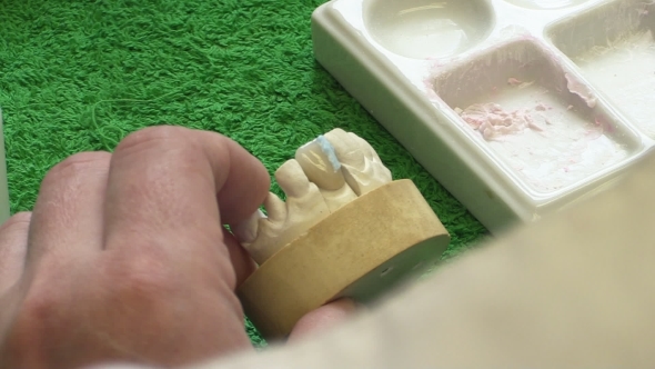 Dentist Working With Ceramic Material, Brush And Dentures. Workplace Dental Technician. 