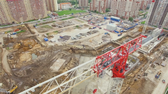 aerial view of a construction crane with cab painted in red-white color