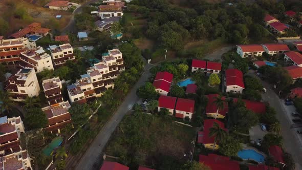 Beautiful Mexican village with red stone rooftops. alt