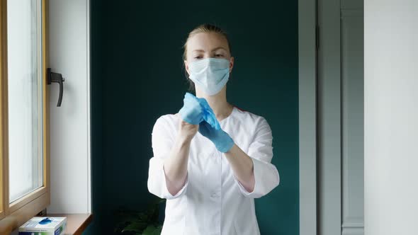 Nurse Puts On Gloves 1