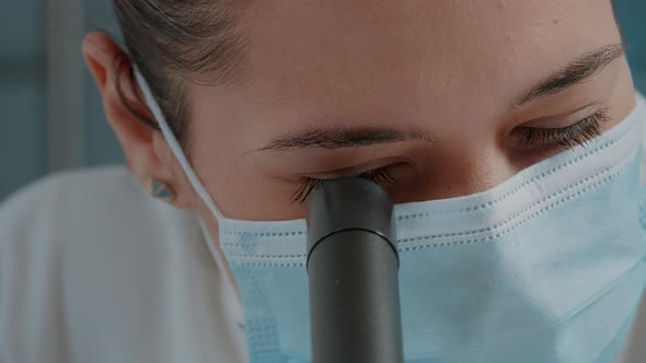 Woman Scientist Using Microscope with Magnifying Glass alt