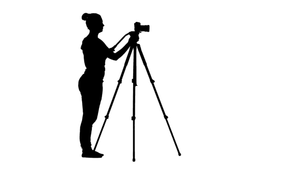 Operator Works, Making Shooting Around Its Axis. Silhouette, White Background alt