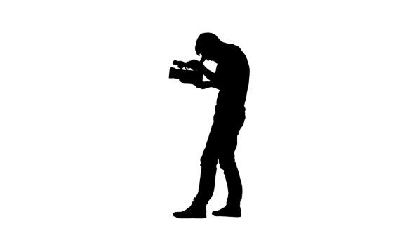 Holding The Camera In Hands Of Operator Makes Videotaping. Silhouette alt