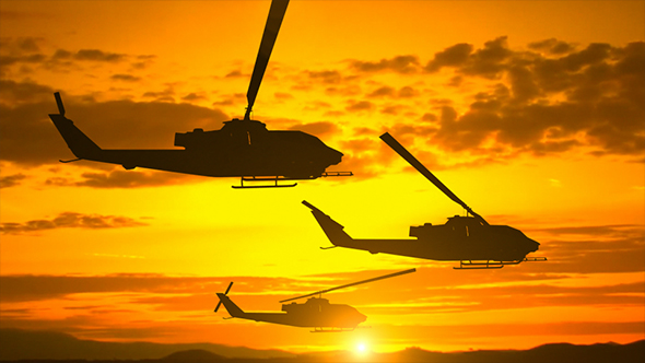 Silhouette Of Three Helicopters Over Sunset