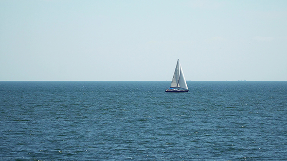 Yacht With Sails Floating in the Sea