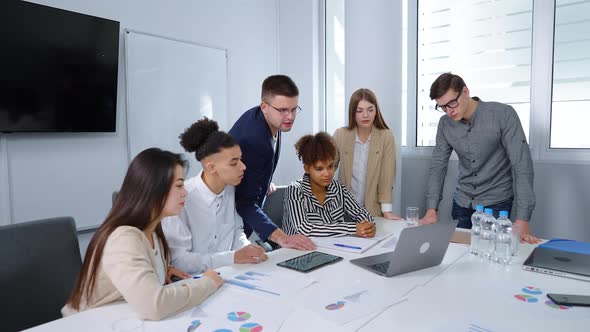 Boss Showing New Project to Business Team at Meeting alt