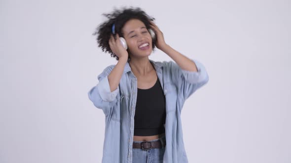Young Happy African Woman Listening To Music alt