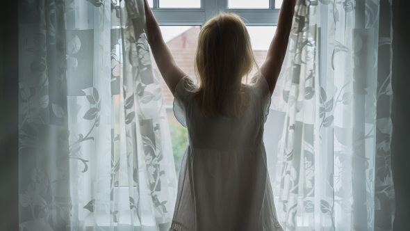 Beautiful Young Woman Opening Curtains in Morning Time 1 alt