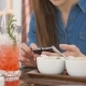 Brunette Girl Uses Smart Phone While Sitting Outside In a Cafe Hot Summer Day - VideoHive Item for Sale