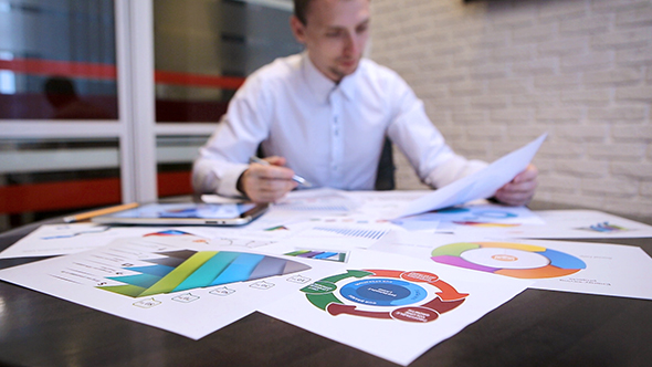 Businessman Analyzing Graphs