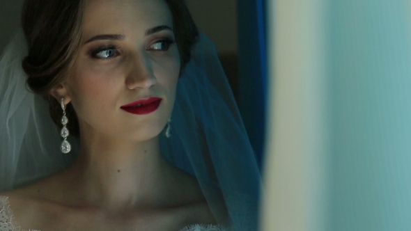 Portrait Of Beautiful Bride Looking At The Window 