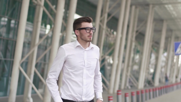 Of Handsome Confident Businessman In White Shirt And Glasses Checking Time On Street While Waiting