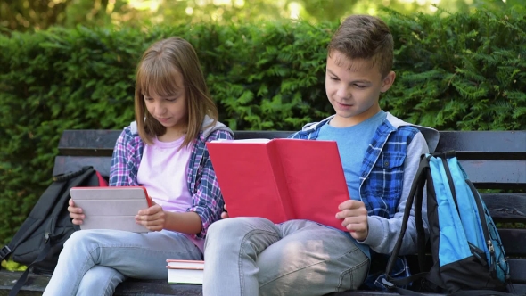 Boy And Girl Reading Book