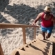 Man Climbing Up Ladder On Tree House At The Beach - VideoHive Item for Sale