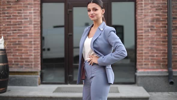 Beautiful Brunette Posing in Stylish Blue Suit in the Street