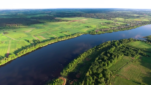 Aerial View Of River In The Fields