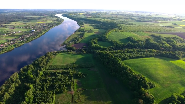 Aerial View Of River In The Fields