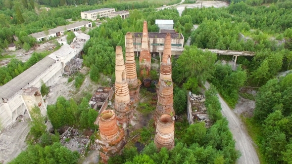 Ruins of Old Factory with High Chimney