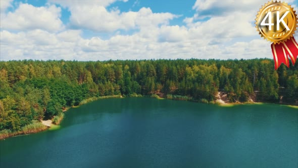 Aerial Flythrough of Beautiful Lake and Forest