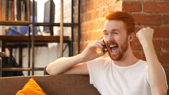 Phone Call, Successful Venture for Excited Man , Sitting on Sofa  alt