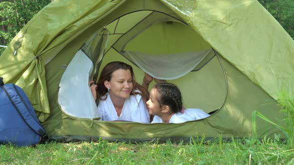 Mother and Daughter in Camping Tent alt