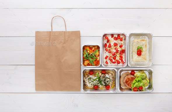 Healthy food take away in boxes, top view at wood - Stock Photo - Images
