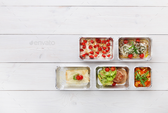 Healthy food take away in boxes, top view at wood - Stock Photo - Images