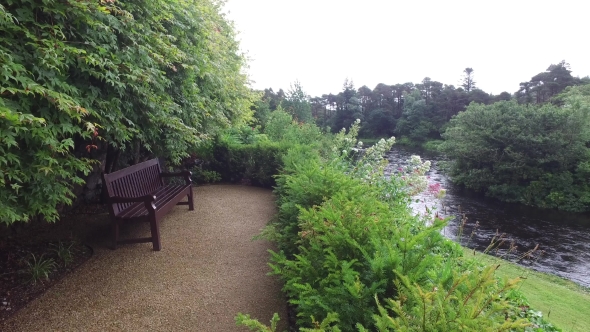 View From Deck With Bench To River In Ireland 7 alt