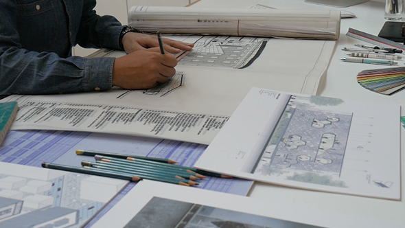 Architect Working to Design Building alt