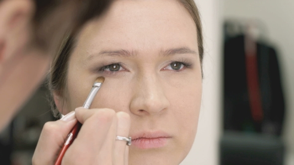 Makeup Artist Making Make-up For Young Model