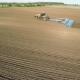  Aerial Footage Of a Modern Tractor Plowing Dry Field, Preparing Land For Sowing - VideoHive Item for Sale