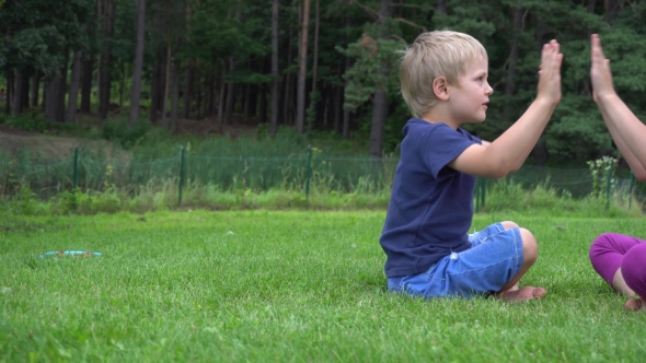 Children Playing On The Grass