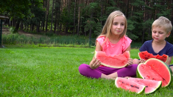 Kids Eating Watermelon Outdoors