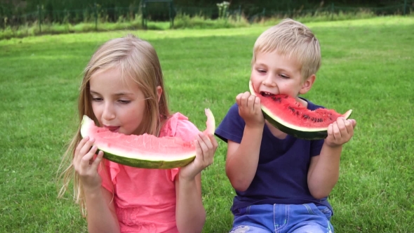 Kids Eating Watermelon Outdoors