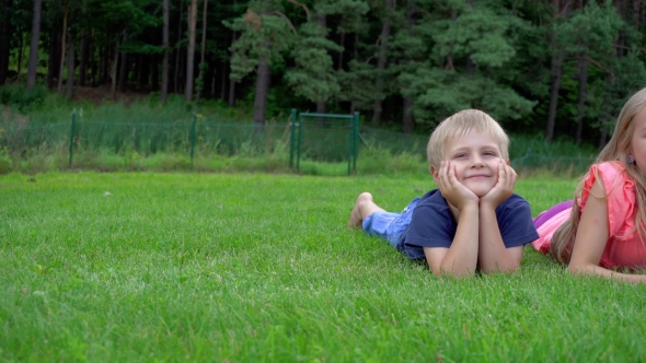 Children Playing On The Grass