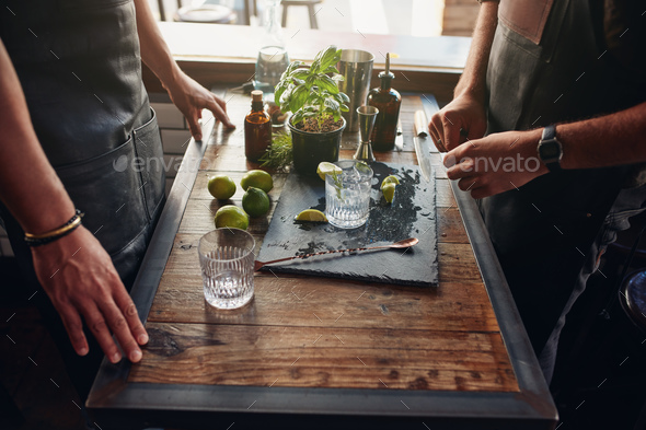 Barmen preparing new cocktail recipe - Stock Photo - Images