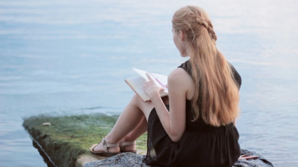 Pretty Girl Reading Book Outdoor