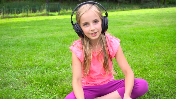 Girl Listen Music On Tablet Outdoors