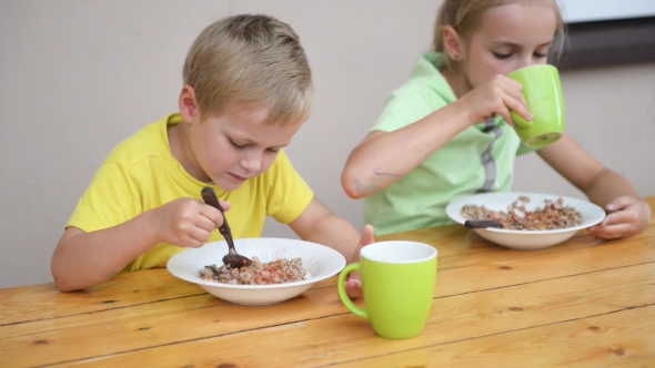 Two Cute Kid Eating