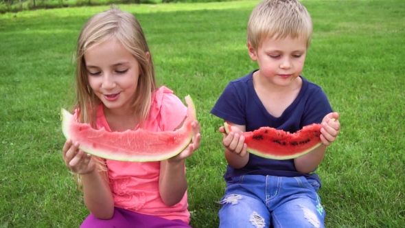 Kids Eating Watermelon Outdoors