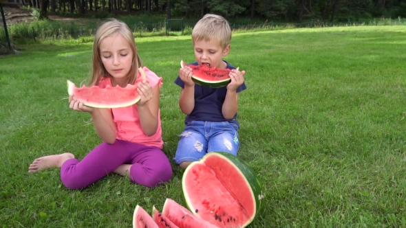 Kids Eating Watermelon Outdoors