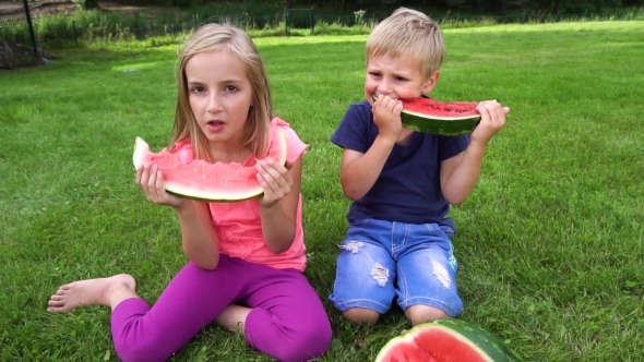 Kids Eating Watermelon Outdoors