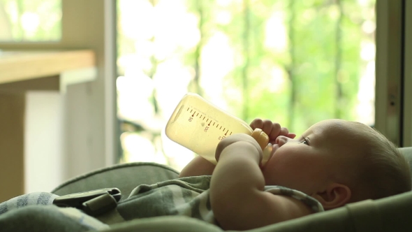 Baby Eating Milk From Bottle