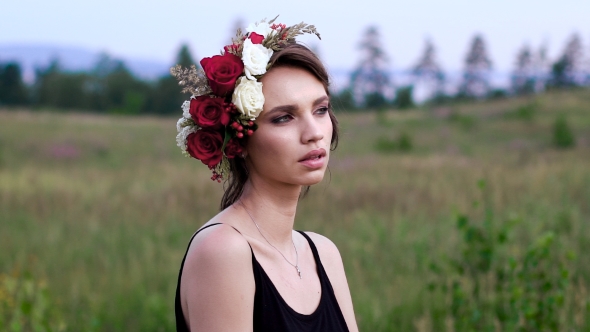 Beautiful Girl in ihe Black Short Dress With the Wreath On Her Head alt