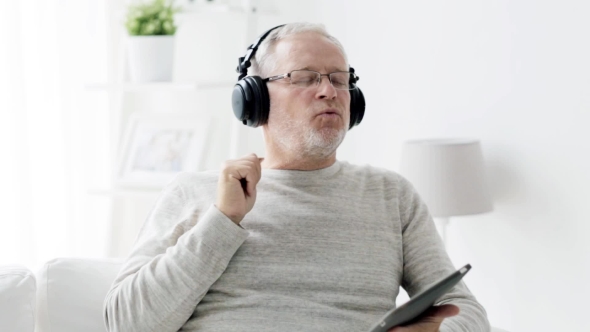 Old Man In Headphones With Tablet Pc At Home 90, Stock Footage | VideoHive