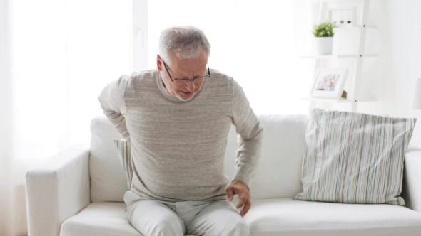 Senior Man Suffering From Backache At Home 28 alt