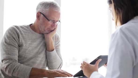 Senior Man And Doctor With Tablet Pc At Clinic 52 alt